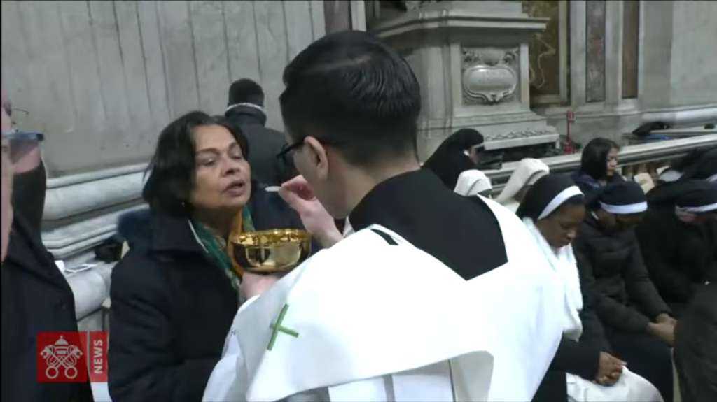 Deacon Tim Tran distributing communion