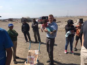 Seminarian holding child