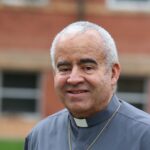 catholic deacon smiling