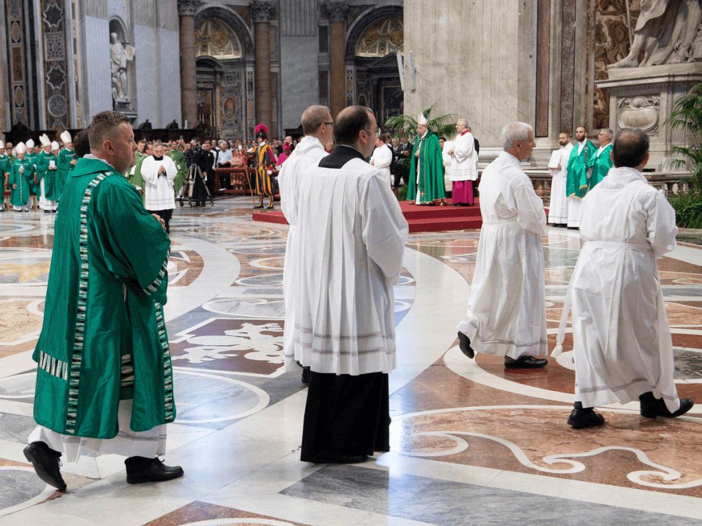 Gudjonsson processes into St. Peter's Basilica along with the rest of the con-celebrators and servers before Mass