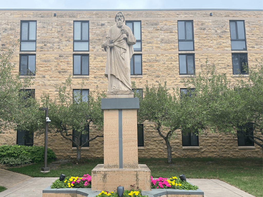 statue of saint paul overlooks saint paul seminary courtyard