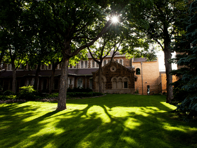 saint paul seminary sun shining through trees