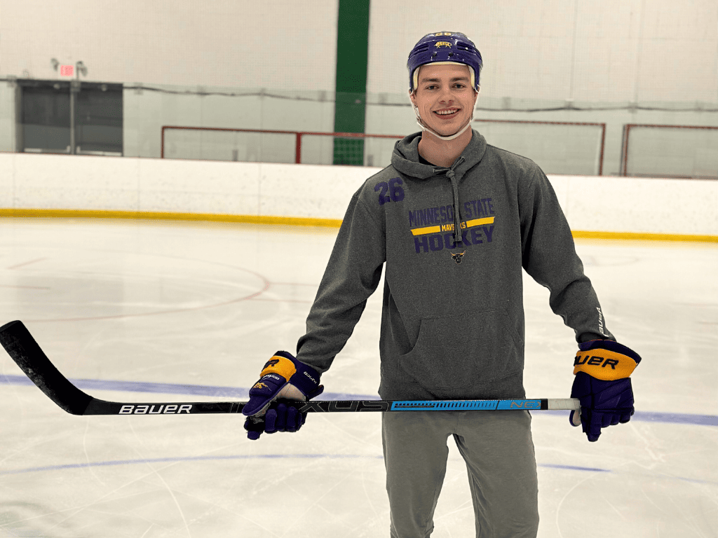 seminarian and former hockey player josh french smiles while skating at cottage grove ice hockey arena