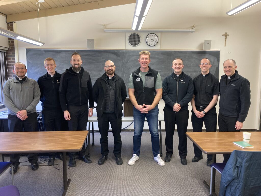 Matt Kirk with seminarians.