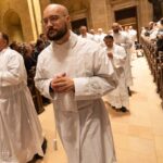 permanent deacon candidates processing into ordination mass