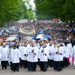 seminarians from the saint paul seminary lead Eucharistic procession down Summit Avenue