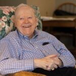 larry mcgough smiling in a chair