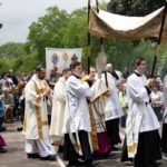 seminarians and bishop alumni from the saint paul seminary take part in a Eucharistic procession in St Paul, Minnesota