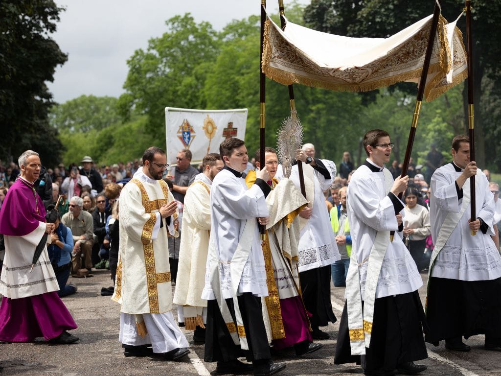 seminarians and bishop alumni from the saint paul seminary take part in a Eucharistic procession in St Paul, Minnesota