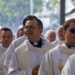 happy catholic priests who prioritize mental health in a procession