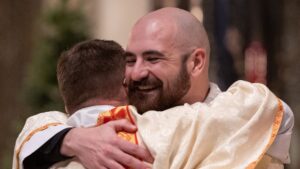 fr nick vance hugs his father deacon chris vance