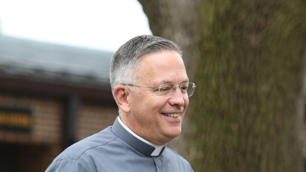 smiling catholic deacon