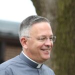 smiling catholic deacon