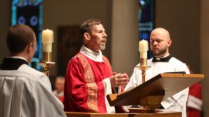 Catholic Deacons proclaiming the Gospel in Mass