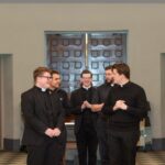 seminarians gather in a chapel to practice processing in before worship