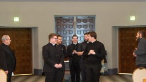 seminarians gather in a chapel to practice processing in before worship