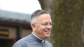 smiling catholic deacon